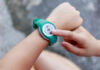 Backward Walking’s Surprising Benefits Person using a fitness tracker on their wrist