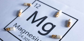 Magnesium element symbol with colorful capsules arranged around it