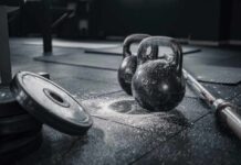 Hollywood Actor’s Surprising Gym Motivation Kettlebells and weights on a gym floor with chalk dust