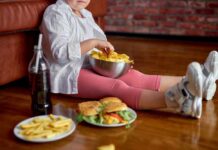 Junk Food’s Brain Impact: Shocking Study Child sitting on the floor enjoying snacks from a bowl