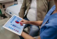 Normal Weight Hides Deadly Trap Nurse showing a patient health data on a tablet