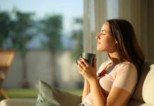 Why ‘Low Dopamine Mornings’ Are Trending Now Woman enjoying a cup of coffee in a sunlit room