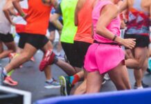 Runners participating in a marathon, wearing colorful athletic gear