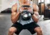 Grip Strength: The Secret To Longevity? Athlete performing a kettlebell squat in a gym