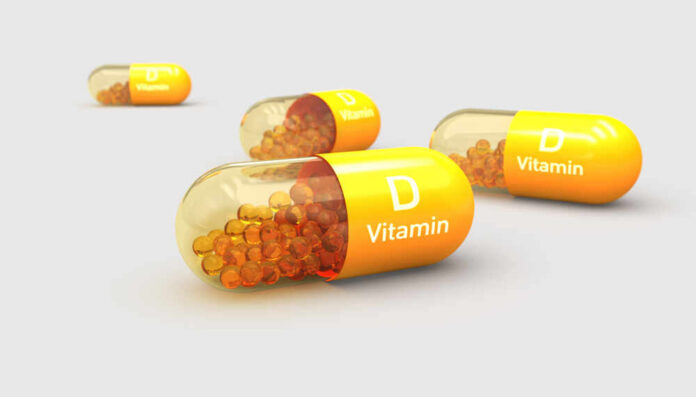 Vitamin D capsules with orange beads inside