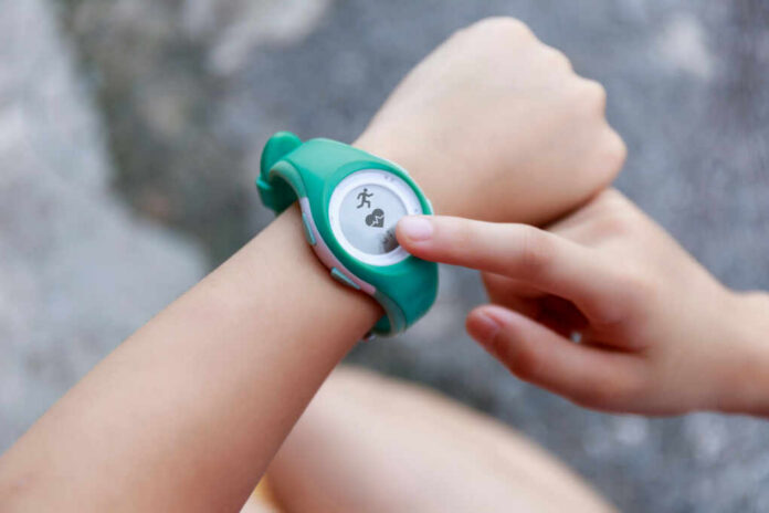 Person using a fitness tracker on their wrist