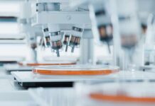 Revolutionary Laser Could Reverse Blindness Automated laboratory equipment with robotic arms dispensing liquids into petri dishes