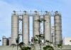 Coal Mines Linked to Mysterious Cancer Surge Metal storage silos against a blue sky