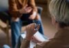 Role of Emotional IQ in Global Health Two individuals engaged in a conversation during a counseling session