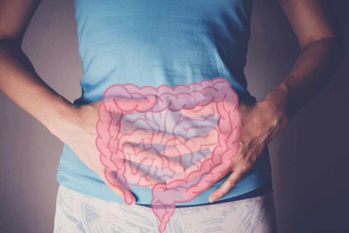 Woman,Hands,On,Her,Stomach,With,Intesline,,Probiotics,Food,For Person holding their stomach with a graphic of intestines overlayed