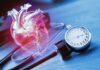 Smartwatch Blood Pressure Alert: Game-Changer Or Trap? An anatomical heart illustration next to a blood pressure monitor