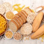 Assorted grains and breads on a wooden table