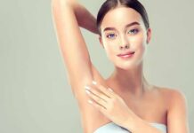 Youthful Skin? Vitamin C’s DNA Play Woman touching smooth underarm with raised arm