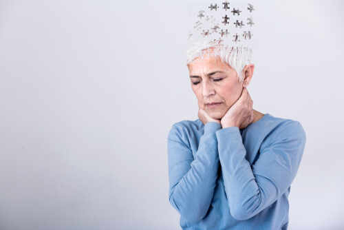Elderly woman with a unique hairstyle made of puzzle pieces, looking thoughtful