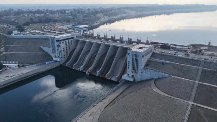 Massive,Hydroelectric,Tabqa,Dam,On,The,Euphrates,River,,Syria Aerial view of a large dam with water flowing through its gates