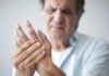 Doctors Flip Script On Arthritis Pain Man holding his hand in discomfort