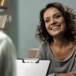 Smiling woman talking during a meeting
