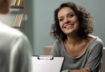 Trapped in Constant Survival Mode? Smiling woman talking during a meeting