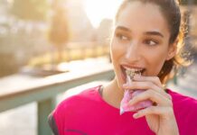 The Nutrient That Helps Your Brain Handle Stress Woman eating a granola bar outdoors