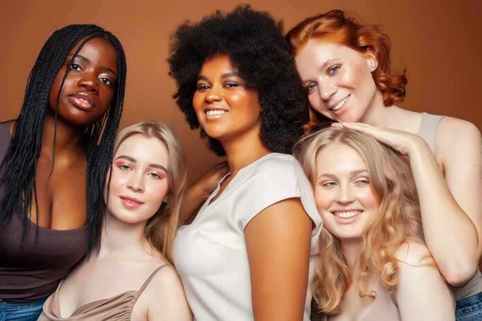 shutterstock_1914251476 Group portrait of five women smiling together