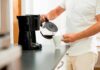Morning Brew, Unexpected Bedroom Boost Person pouring coffee from carafe into mug beside drip coffee maker