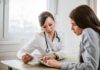 Doctors Redefine Aging — The Frailty Trap Doctor consulting a patient at a desk