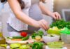 Plant Variety in Diet Beats Quantity – Here’s Why Person preparing a fresh salad with green vegetables in a kitchen
