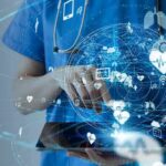 Healthcare professional using a digital tablet with medical data icons