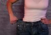 How to Lose Weight Fast: Scientific and Sustainable Habits person in white tank top showing loose jeans waistband