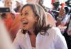 Laugh Too Hard… Then Collapse? smiling woman in a crowd