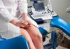 Diagnosis and management of endometriosis Patient on gynecological exam chair beside ultrasound machine