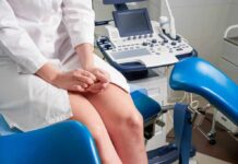 Diagnosis and management of endometriosis Patient on gynecological exam chair beside ultrasound machine
