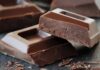 Dark chocolate: A workout performance booster? Chocolate bars with rough edges on a dark surface