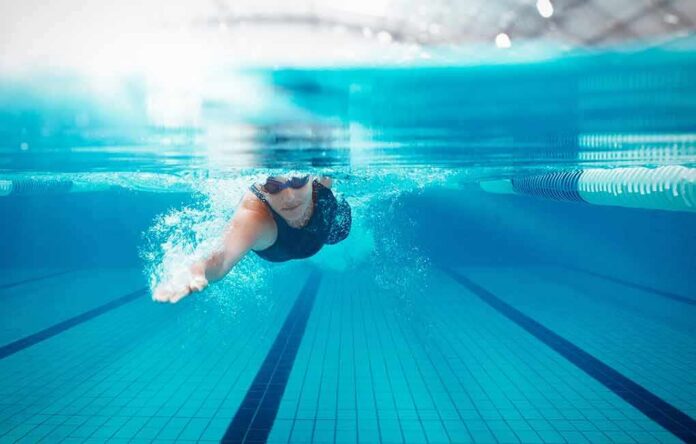 swimmer underwater in a lane pool