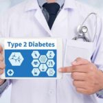 Doctor holding tablet about type 2 diabetes