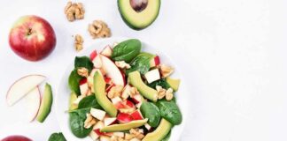 Spinach salad with apple, avocado, and walnuts