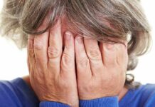 Early Retirement’s Brain Tax person covering their face with both hands