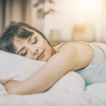 Woman sleeping on a bed