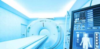 MRI or CT scanner with control monitor in hospital room