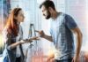 Best Way to Respond to Passive-Aggressive Comments Two adults arguing indoors, man pointing at woman holding a phone