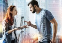 Best Way to Respond to Passive-Aggressive Comments Two adults arguing indoors, man pointing at woman holding a phone