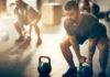 Does lifting weights really help you live longer? Man lifting kettlebell in gym