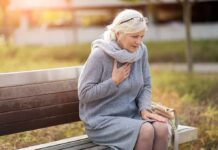 Preventing Chronic Diseases – What You Can Do Now Older woman on park bench holding chest
