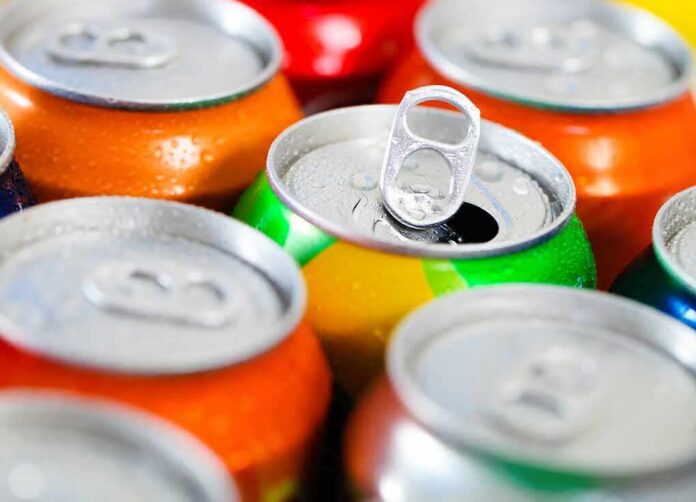 shutterstock_122500525-3 Assorted soda cans with one open pull-tab