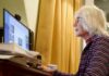 Why Time Usually Speeds Up as You Get Older Older woman using a desktop computer at a desk