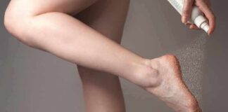 Bare foot being sprayed with aerosol