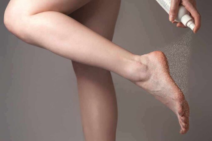shutterstock_1401620663- Bare foot being sprayed with aerosol