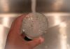 PFAS Surprise In ‘Safe’ Water Filters Hand holding a glass under a running faucet