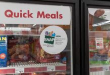 Two types of food linked to depression risk in adulthood Grocery freezer door labeled Quick Meals with SNAP program sticker