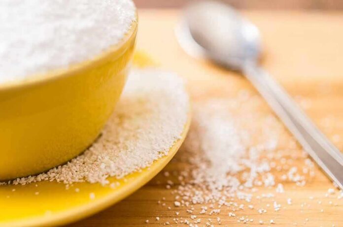 shutterstock_270403325 Yellow bowl and plate with spilled granulated sugar